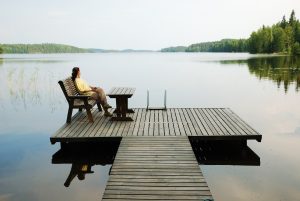 lady sitting at lake